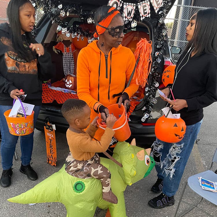 Halloween trunk-or-treat event with costumes
