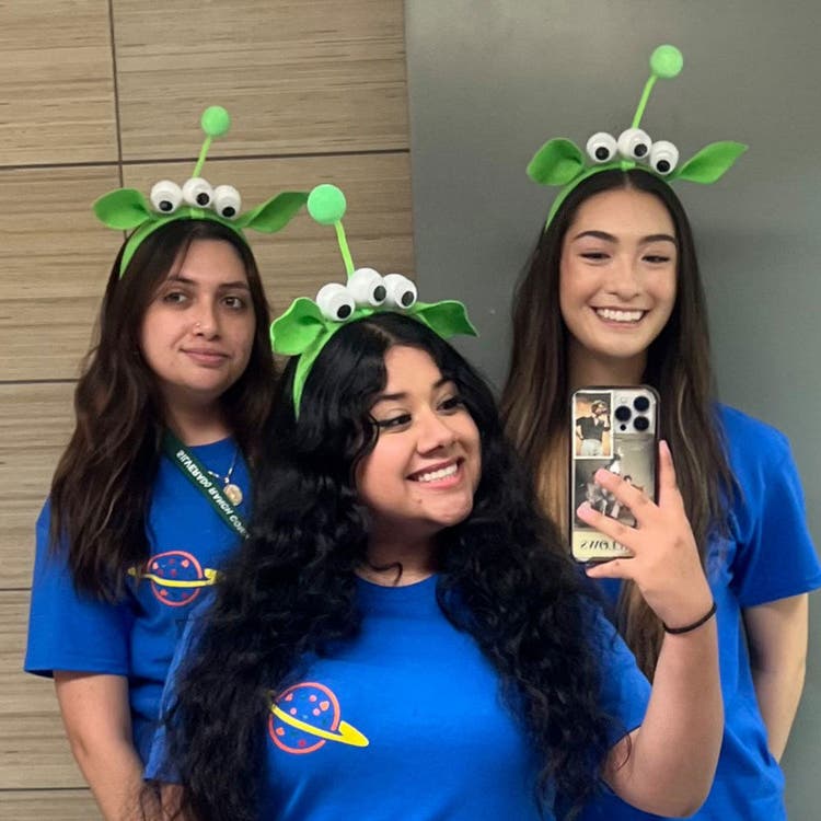 Group in Alien-Themed Headbands and Blue Shirts