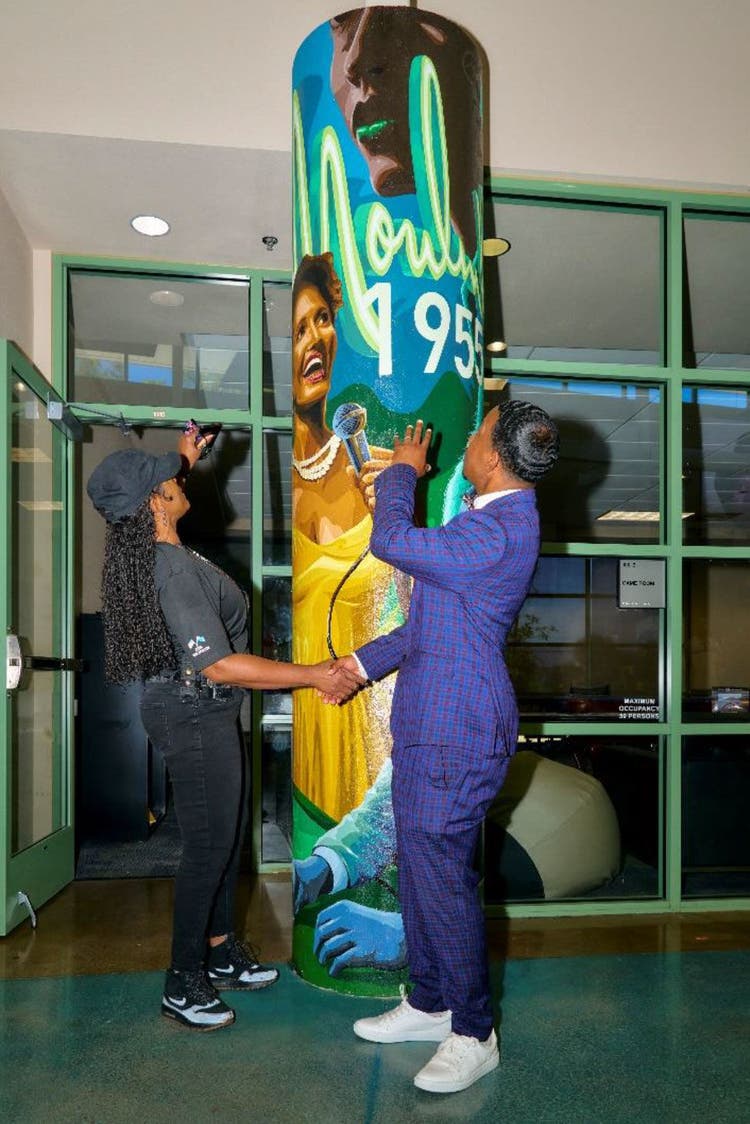 Colorful mural with two people indoors